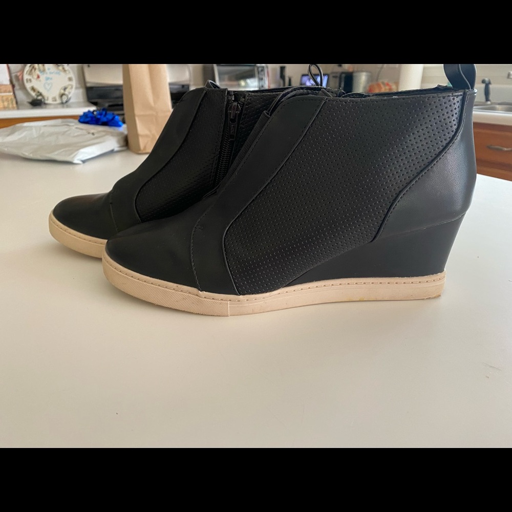 Black wedge tennis shoes in good condition. Only worn a few times.